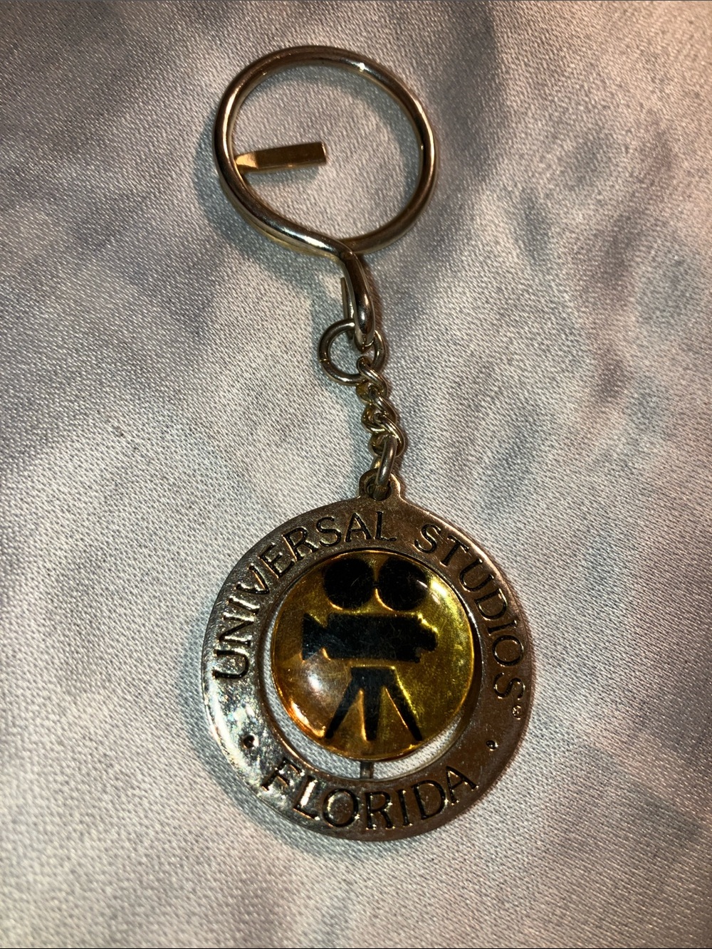 Vintage spinning Universal Gold and Silver Film Camera Keychain